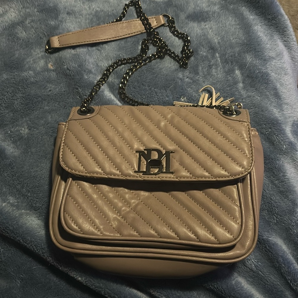 Small tan bag with leather chain link straps